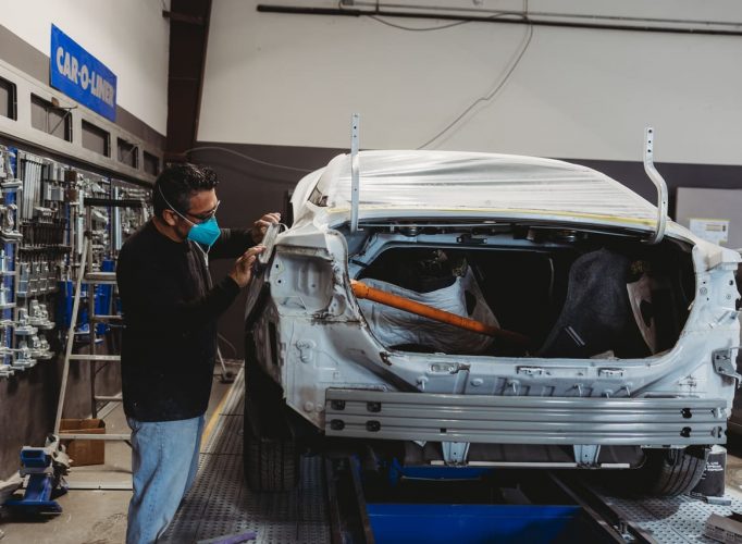 a car undergoing body work by OEM ASE Certified technicians at the best auto body shop in Hosuton, TX